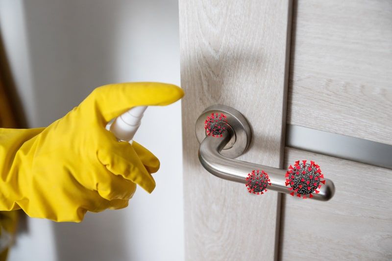 sanitizing a door handle