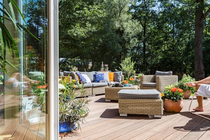 plants and sofas on the outdoor deck