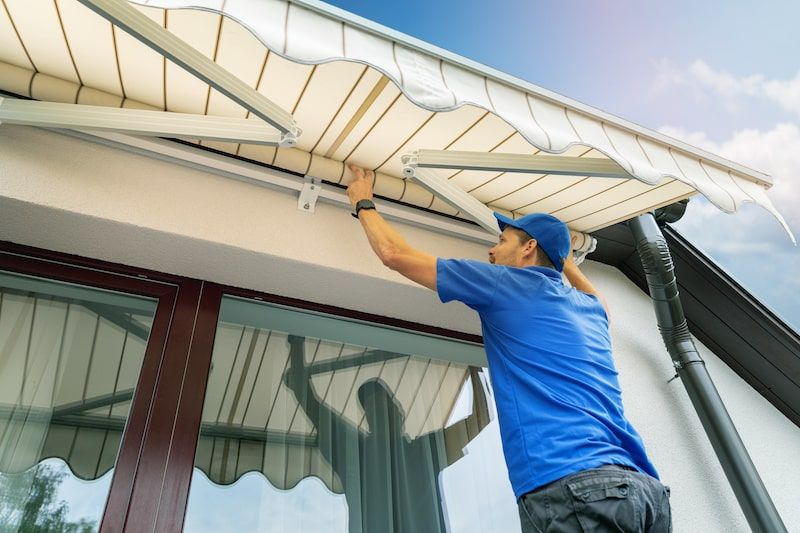 Man putting up Awnings