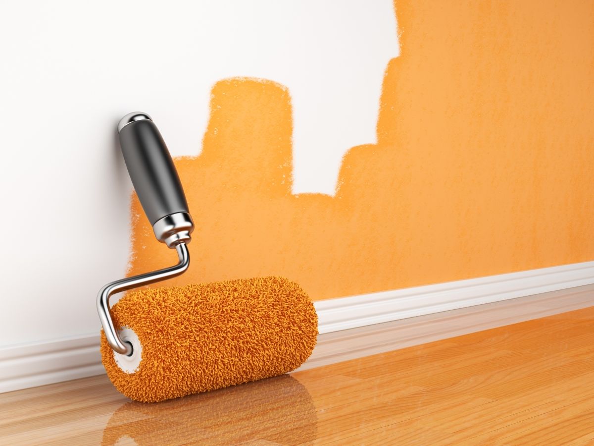 A wall with three-fourth of its surface painted with orange colors