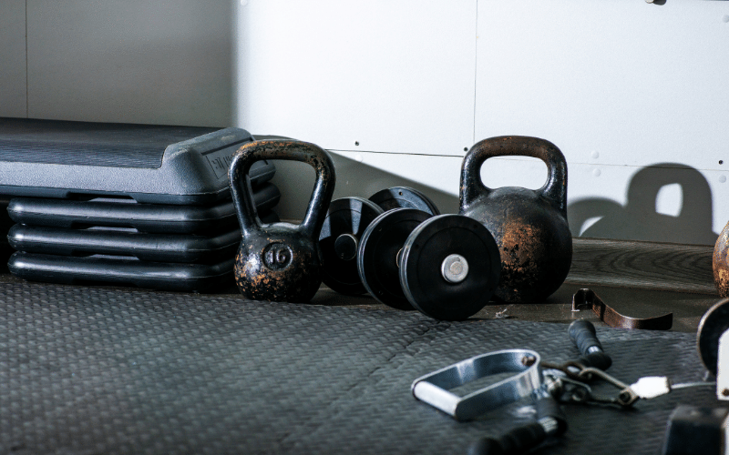 kettlebells of various weights on a gym floor