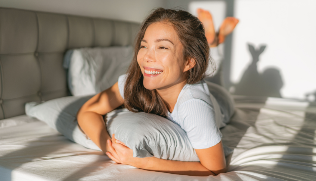 Woman waking up happy, smiling