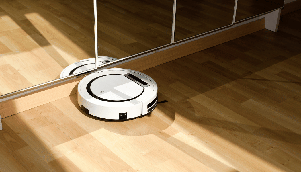 Robot vacuum cleaning along a wall
