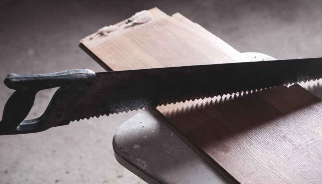 Handsaw on a plank of wood