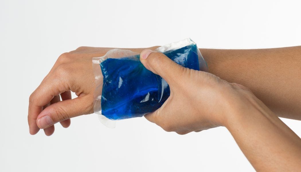 a person holding a ice pack to his hand