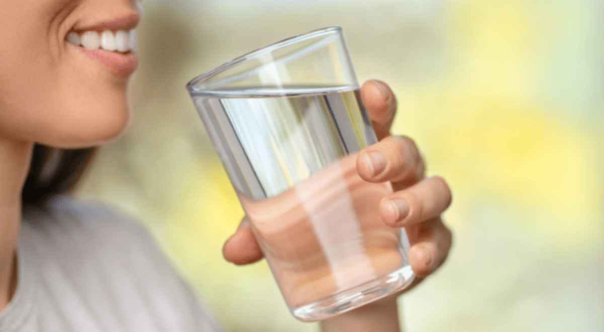 woman with a glass of water