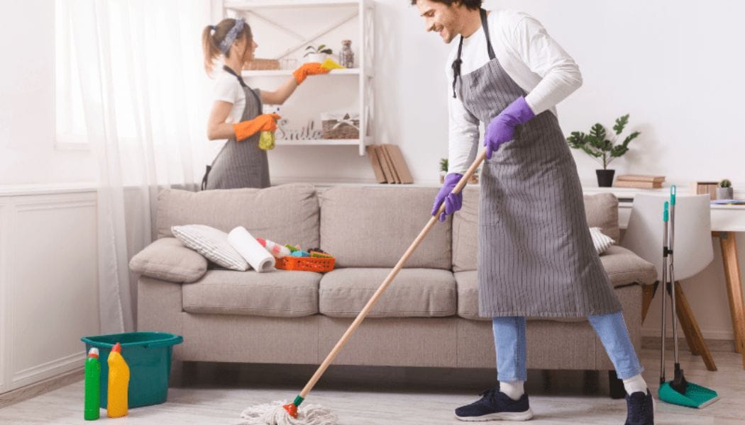 Couples deep cleaning home