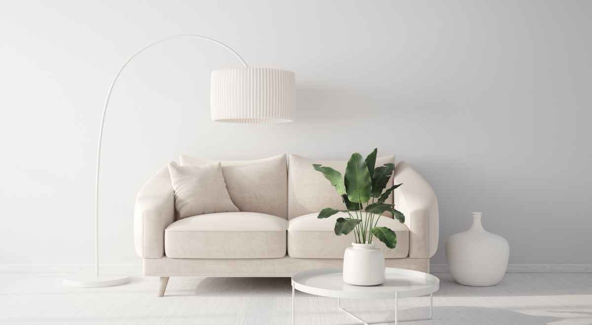 White sofas, lights, and vase