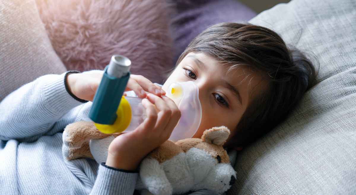 a child breathing with his inhaler