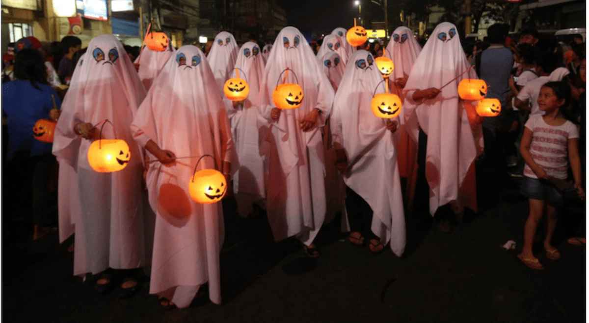 people dressed in ghost costumes