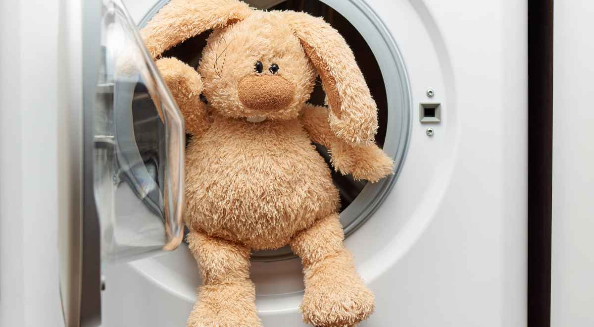 A bunny soft toy in the washing machine