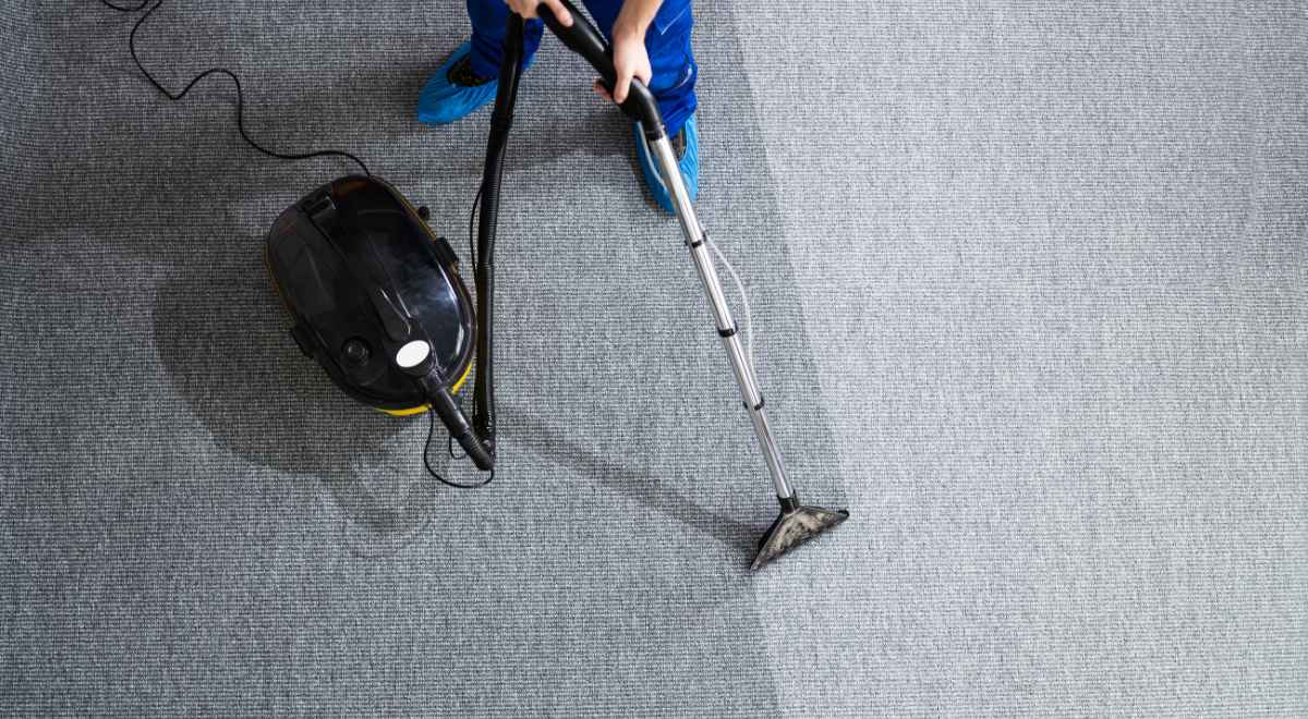 vacuuming the carpet