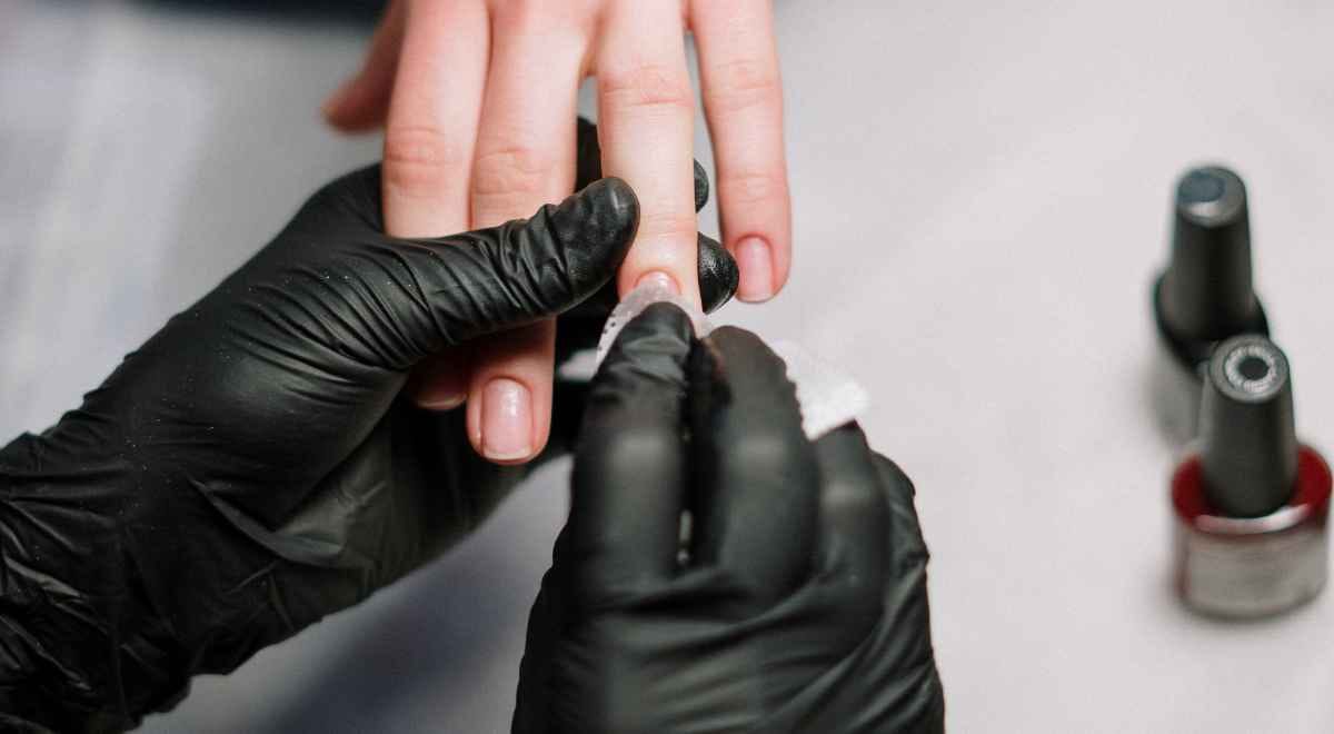 nail art being done on someone's fingers