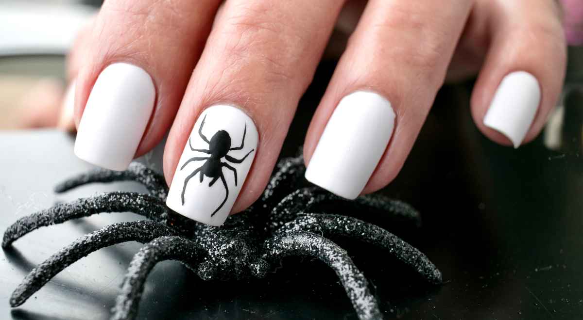 spider nail art on fingers