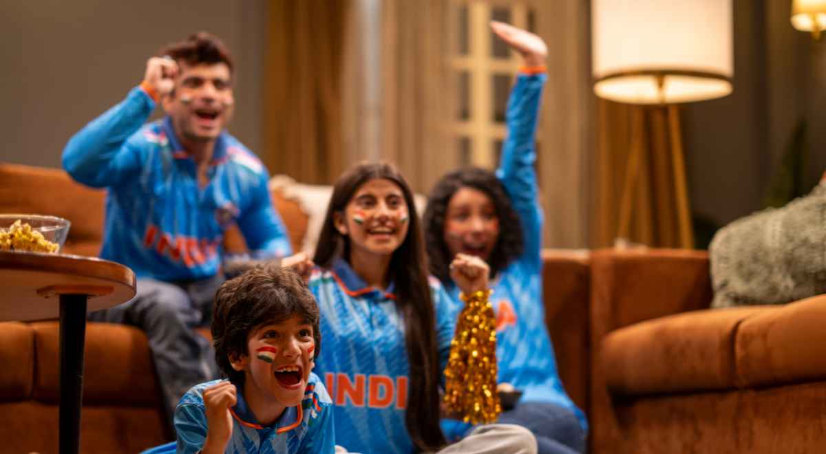 A family of four celebrating India's cricket victory