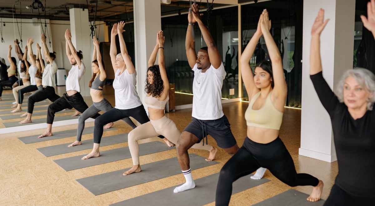 Many people doing yoga together