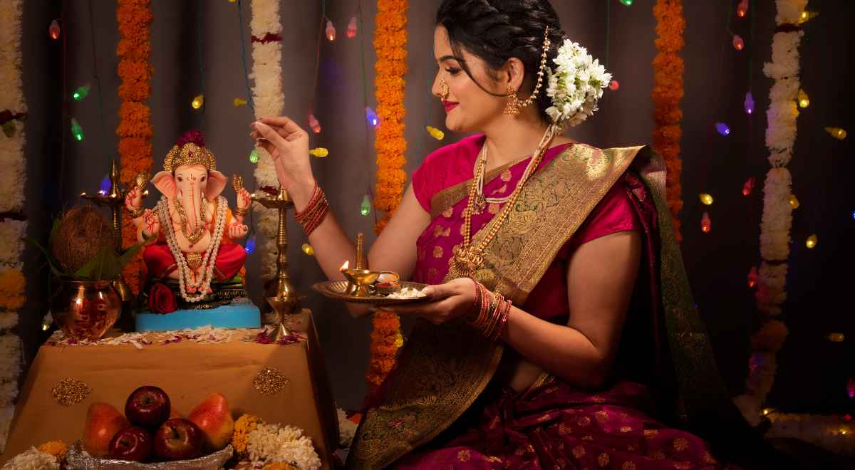 girl doing Ganesha pooja