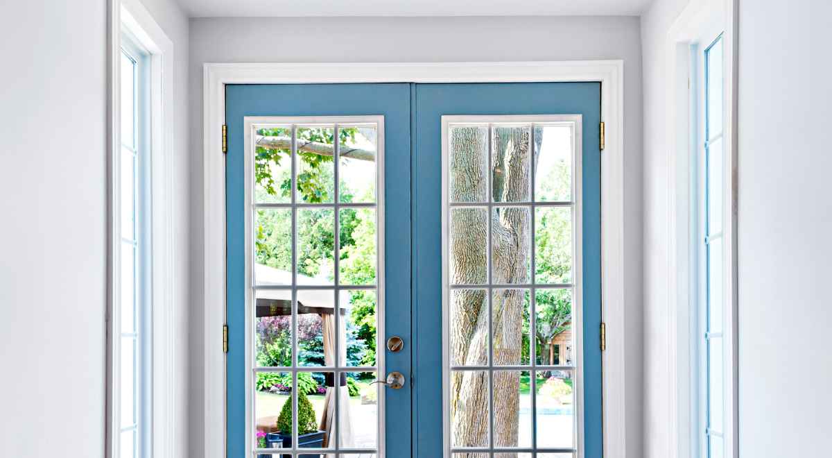 a front door with glass inserts