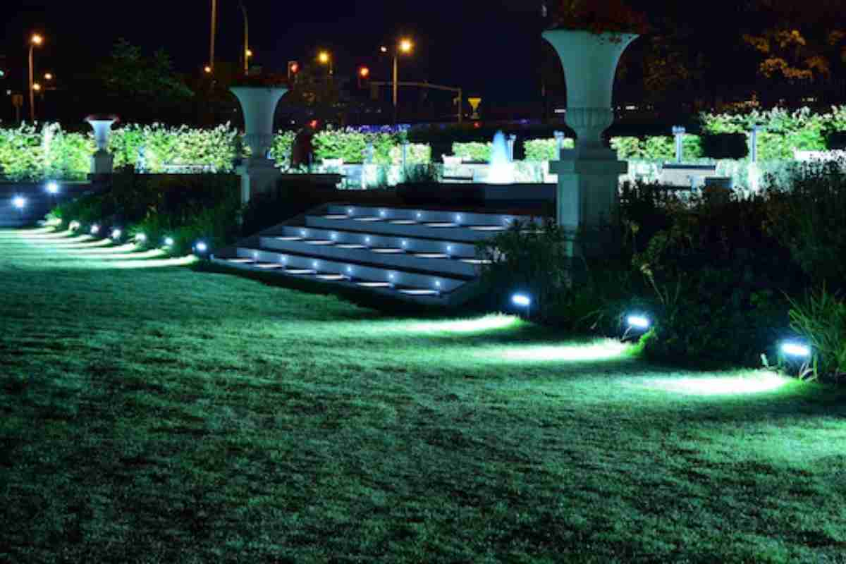 A beautifully lit garden and outdoor staircase area