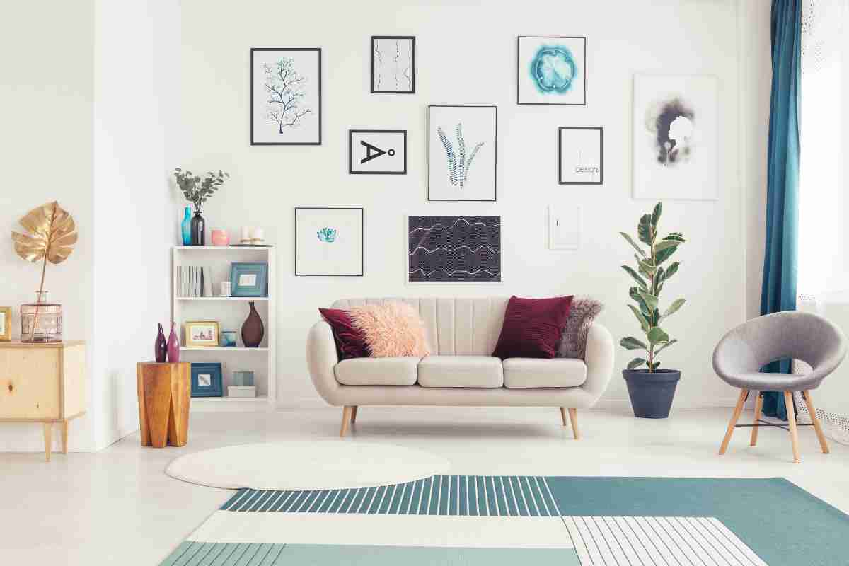 Art covers an entire wall in a living room