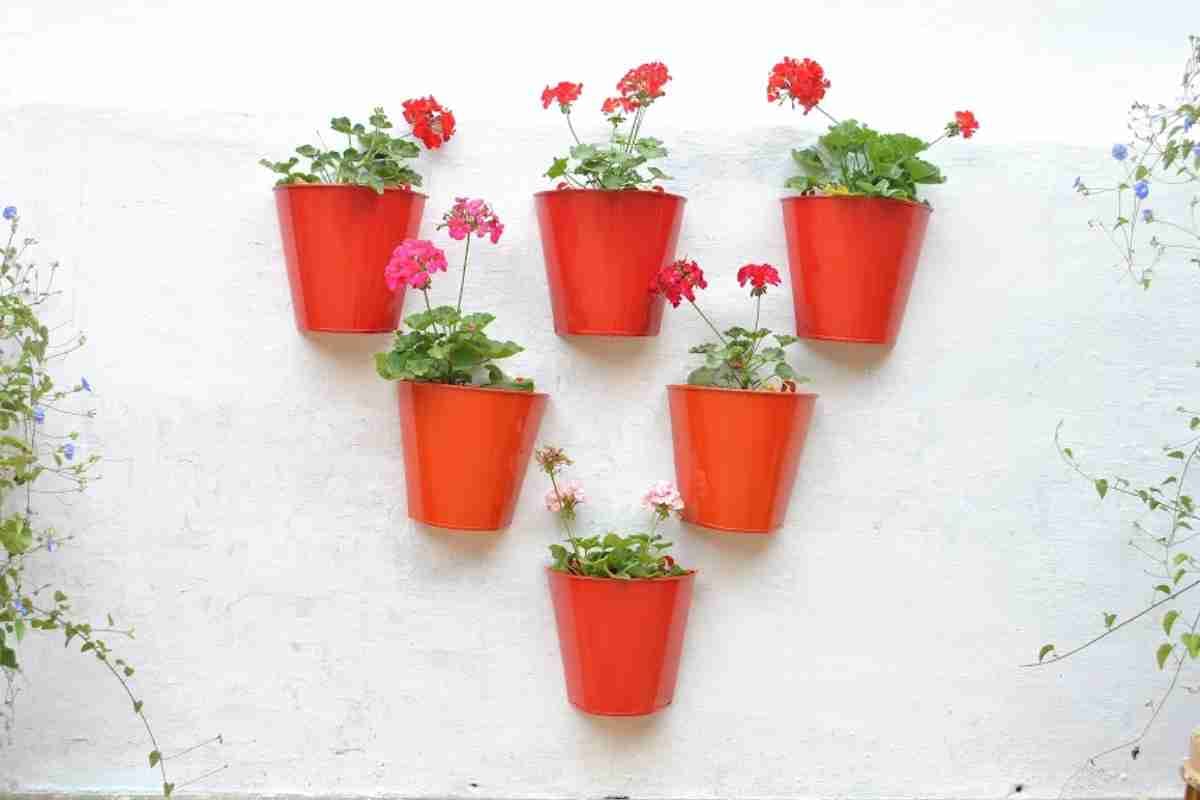 Bright metal pots brighten up a white wall