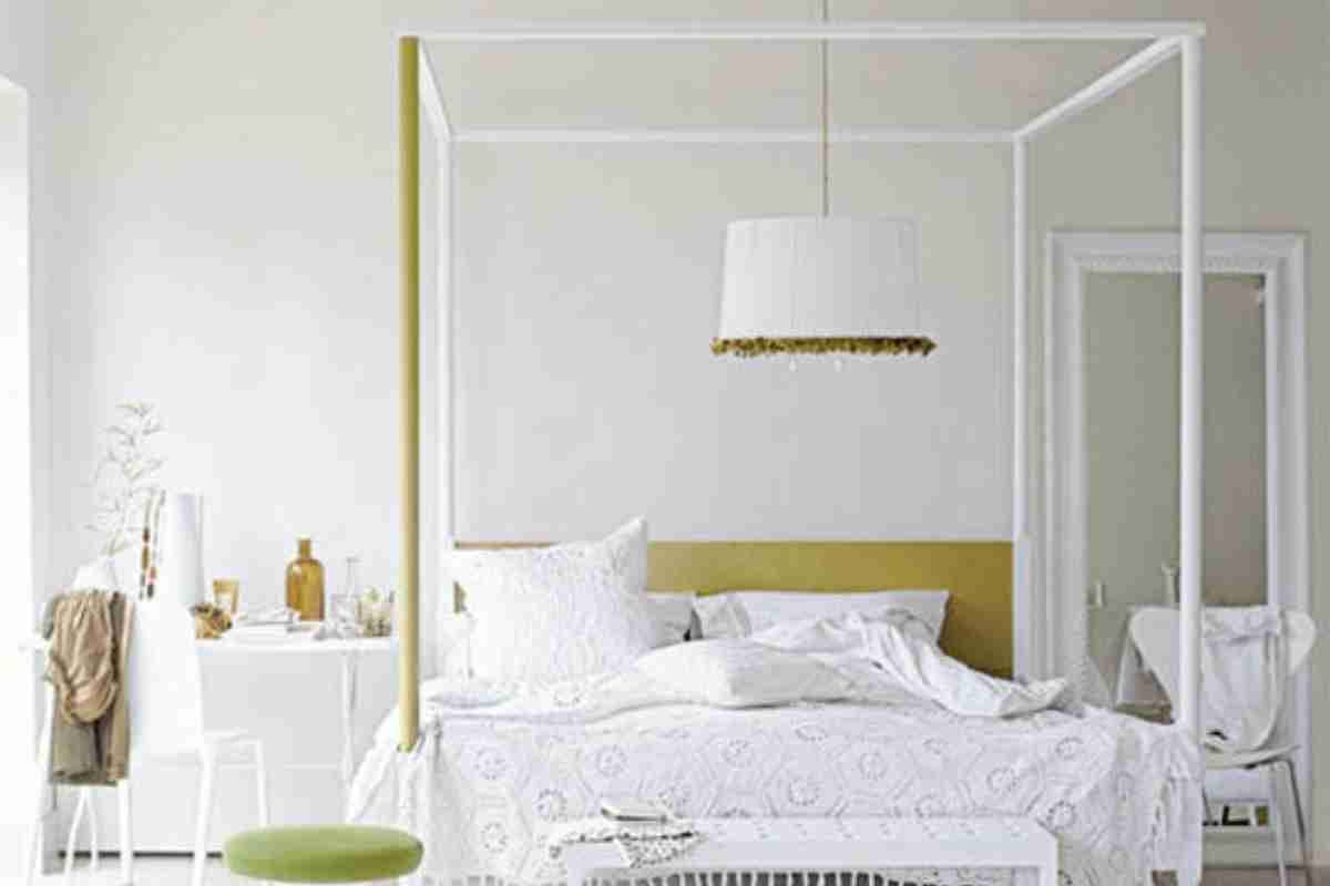 A large pendant lamp over a bed is a bad idea