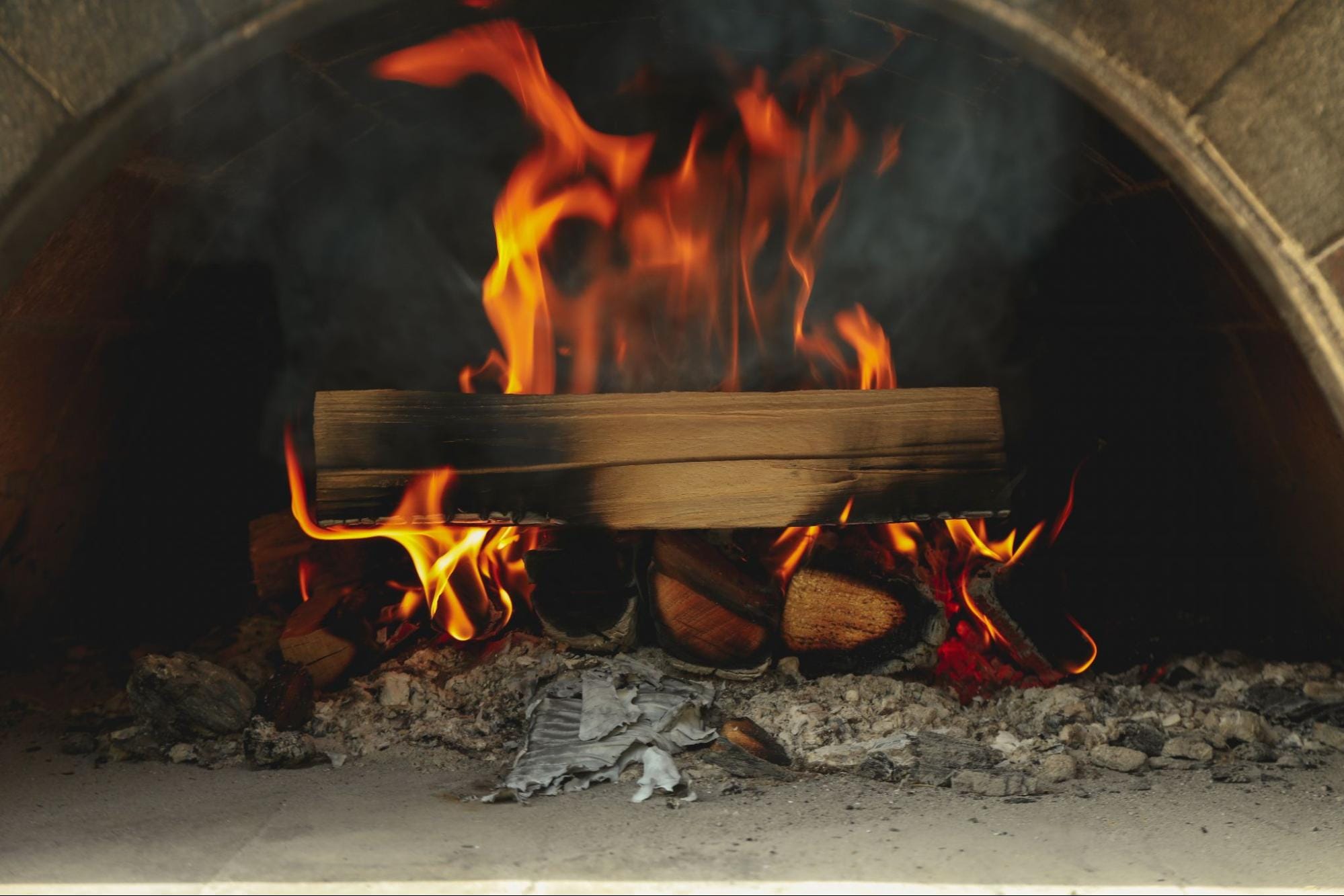 wood burning in a brick oven