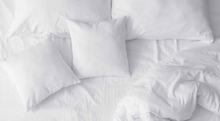 white Pillows on a bed