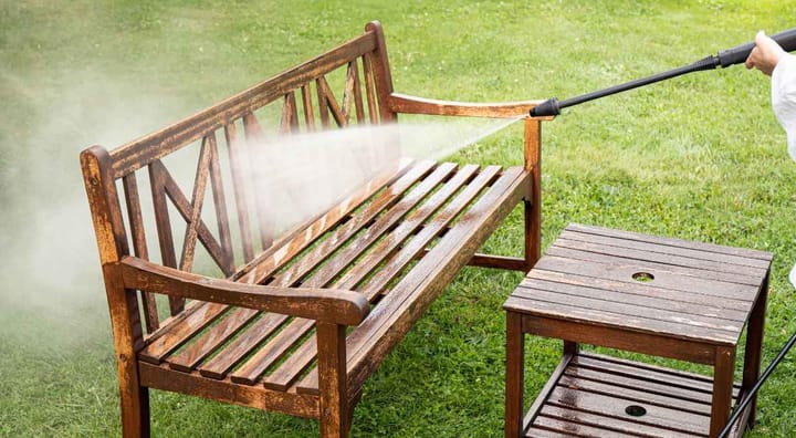 cleaning a wood bench with water