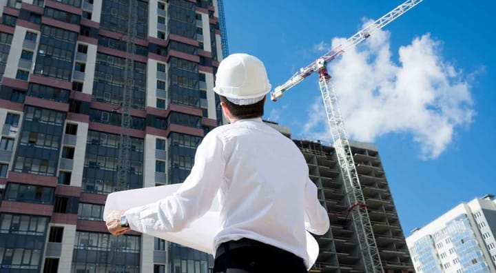 an architect looking at a building