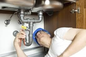 plumber fixing pipes