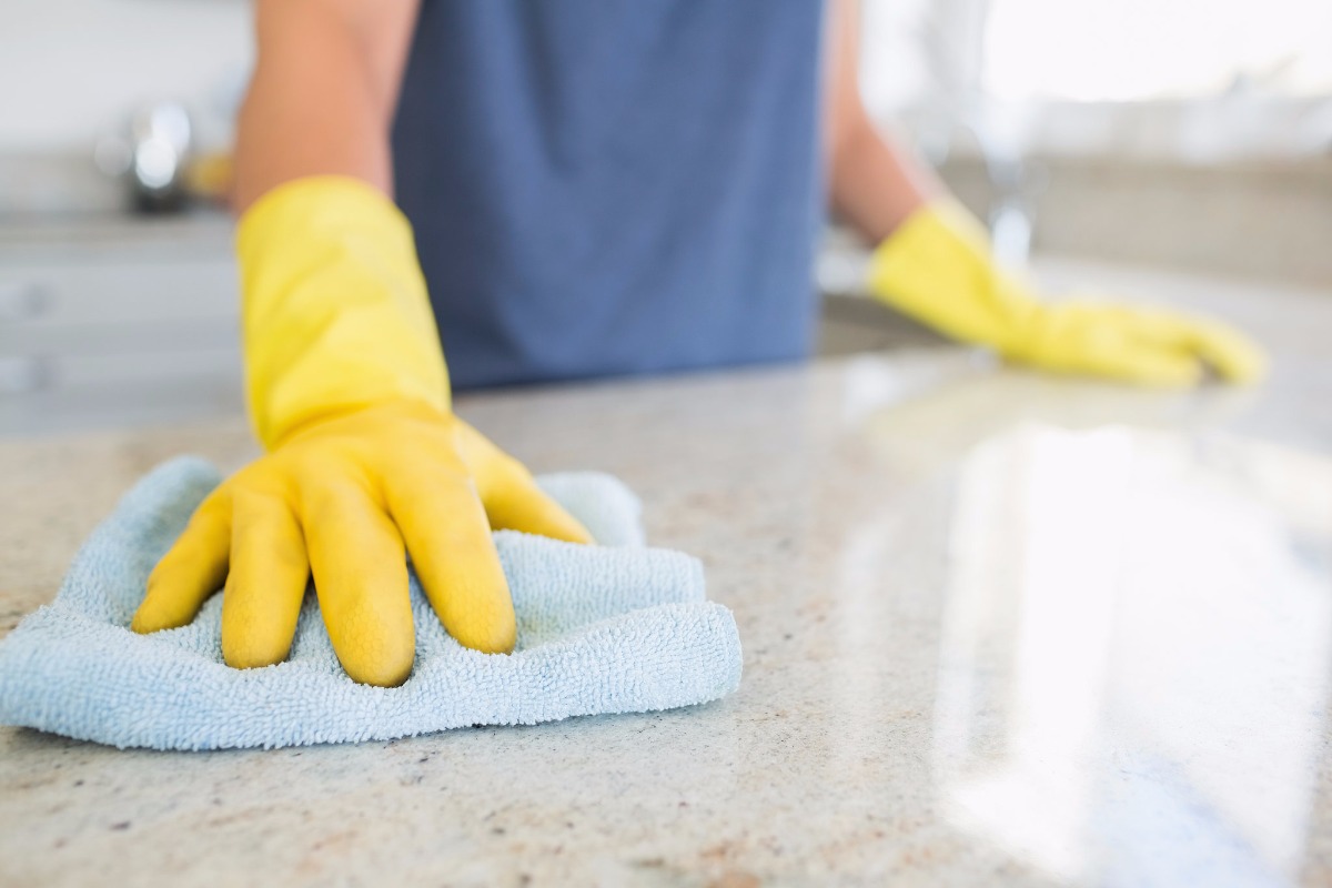 cleaning a kitchen cabinet