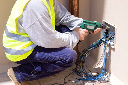 man drilling a hole