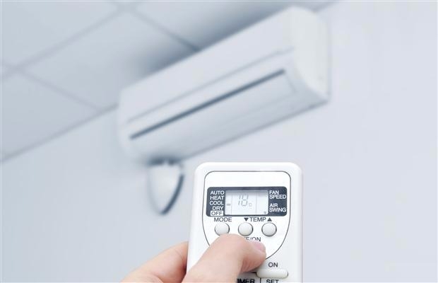 air conditioner being set with its remote controller