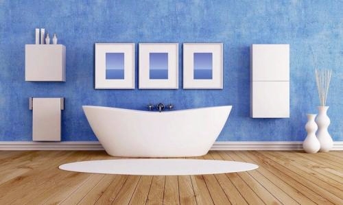 bathtub in a blue color bathroom