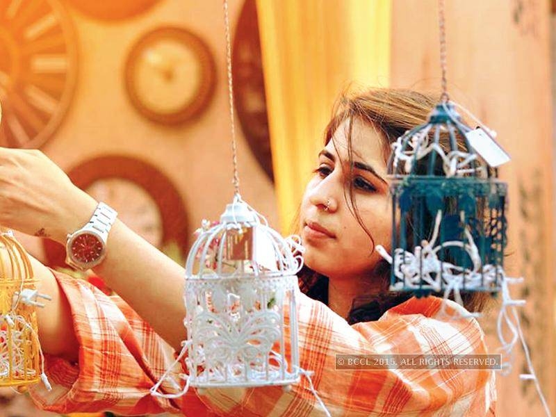 woman hanging up decorations