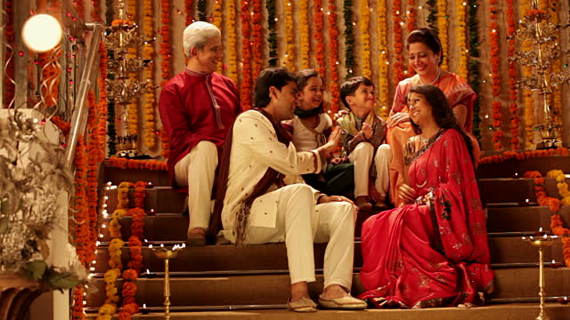 a family sitting together in a decorated home