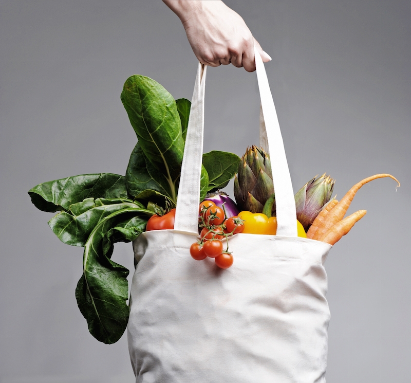 shopping bag filled with veggies