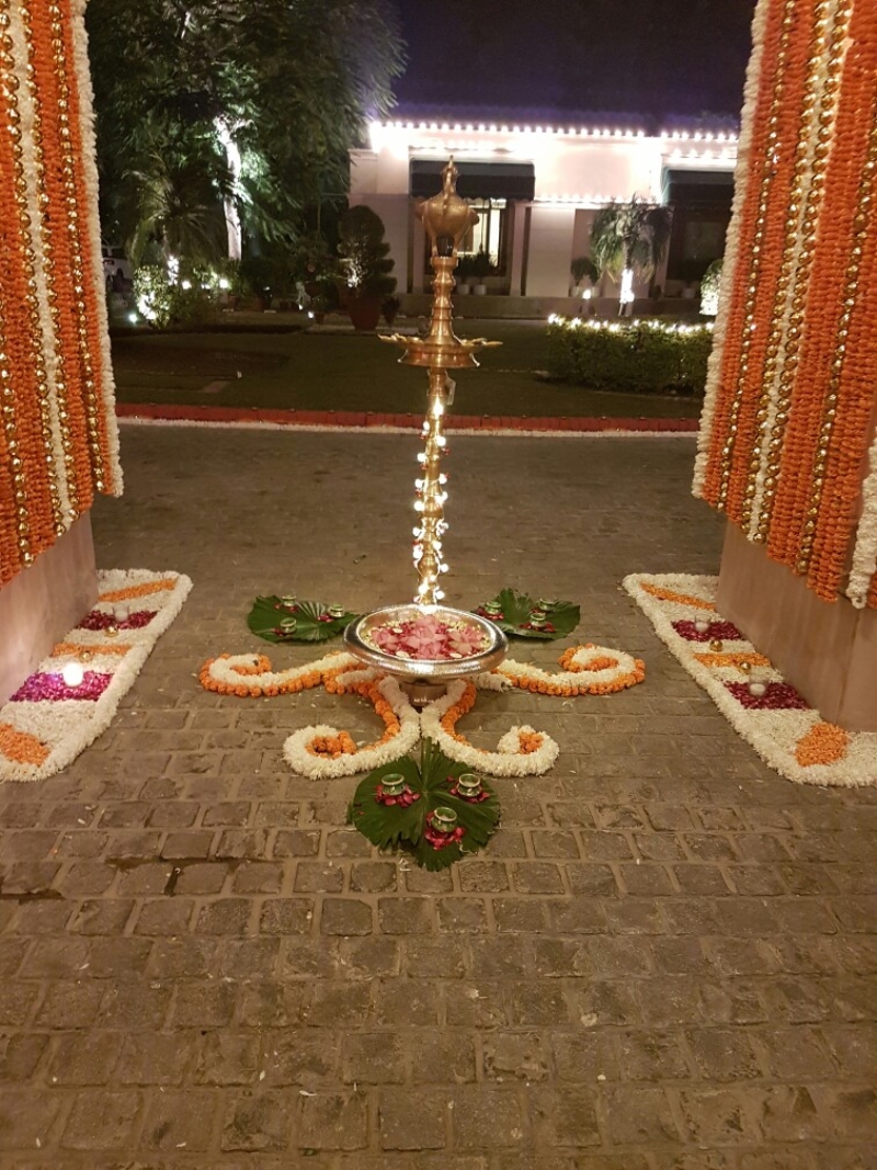 entrance decorated with flower rangoli