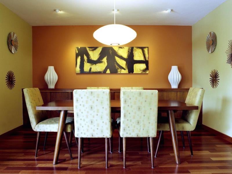 Dining room table placed under overhead lights