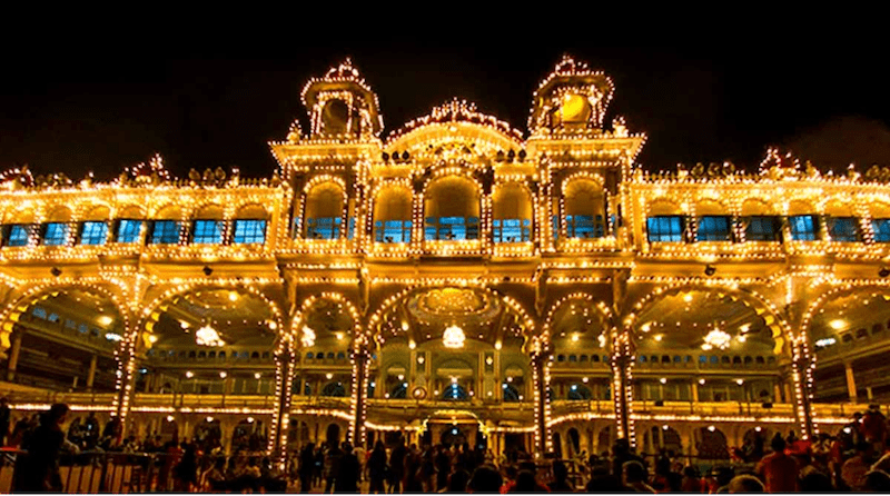 A huge building decorated with festive lighting