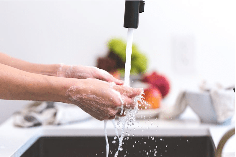 washing hands in the kitchen