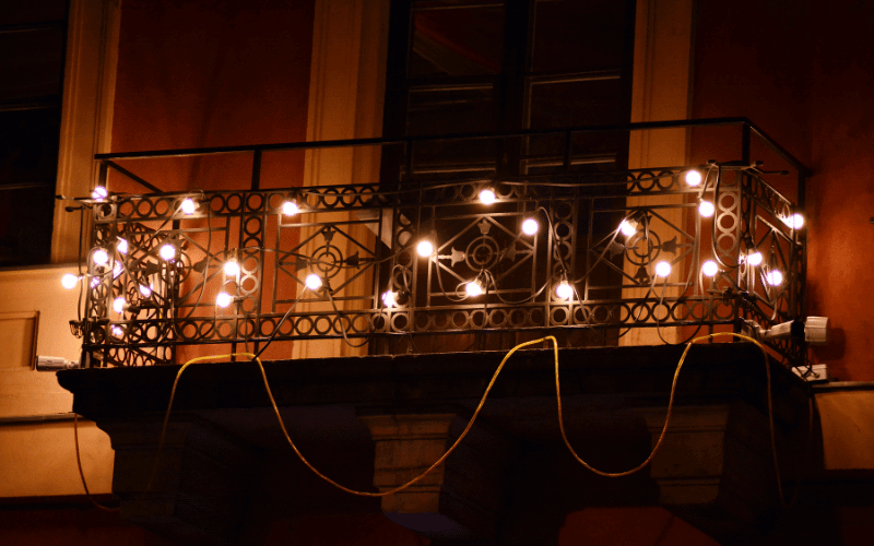 balcony lit up with lights in the night