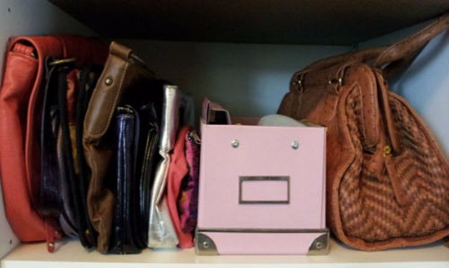 Purses and wallets arranged vertically