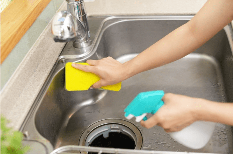 scrubbing the sink